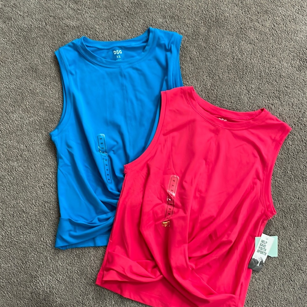 2 sleeveless workout shirts, 1 aqua and 1 pink, both xs